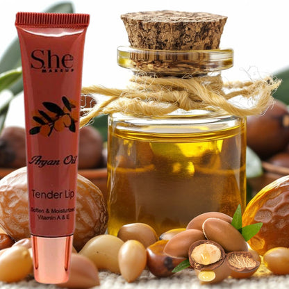 She Mango Argan Oil product with argan nuts and oil bottle on a natural background