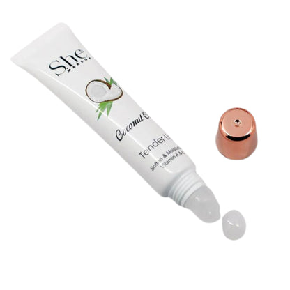 She Coconut Cream Tender lip balm with a droplet of product on a white background