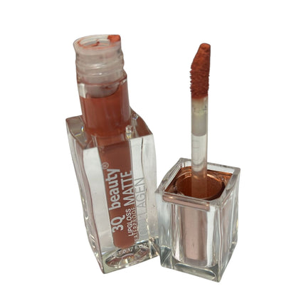 Lip gloss with applicator on a white background