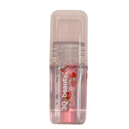 Clear lip oil container with visible branding on a white background