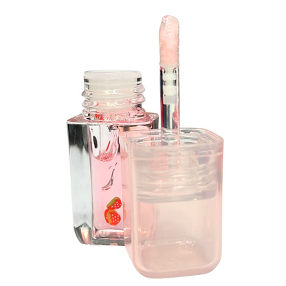 Pink nail polish bottle with applicator on a white background