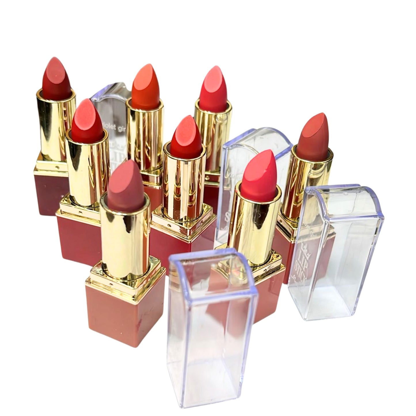 Set of red lipsticks with gold caps on a white background