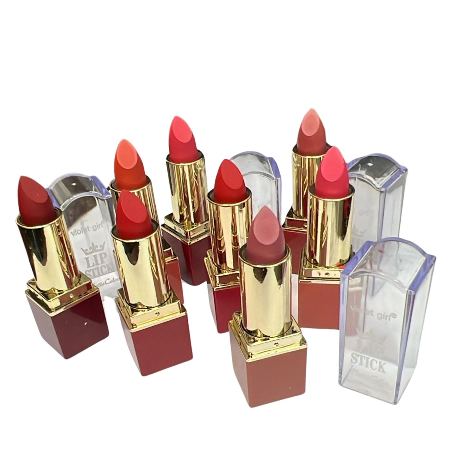 Set of lipsticks with gold and red accents on a white background