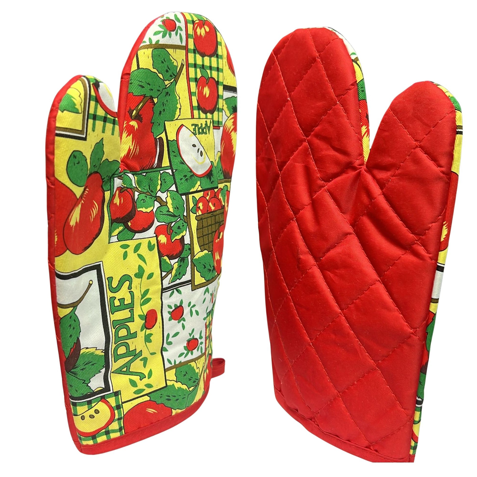 Red quilted oven mitt with colorful vegetable pattern on a white background