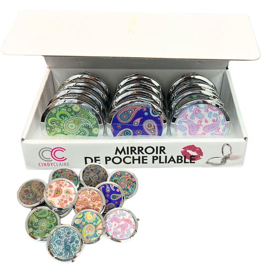 Set of compact mirrors with colorful designs in a display box, featuring the brand 'Cindy Claire'.