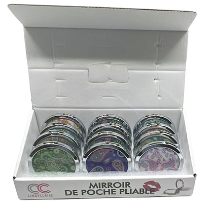 Set of compact mirrors in a box with 'CC' branding