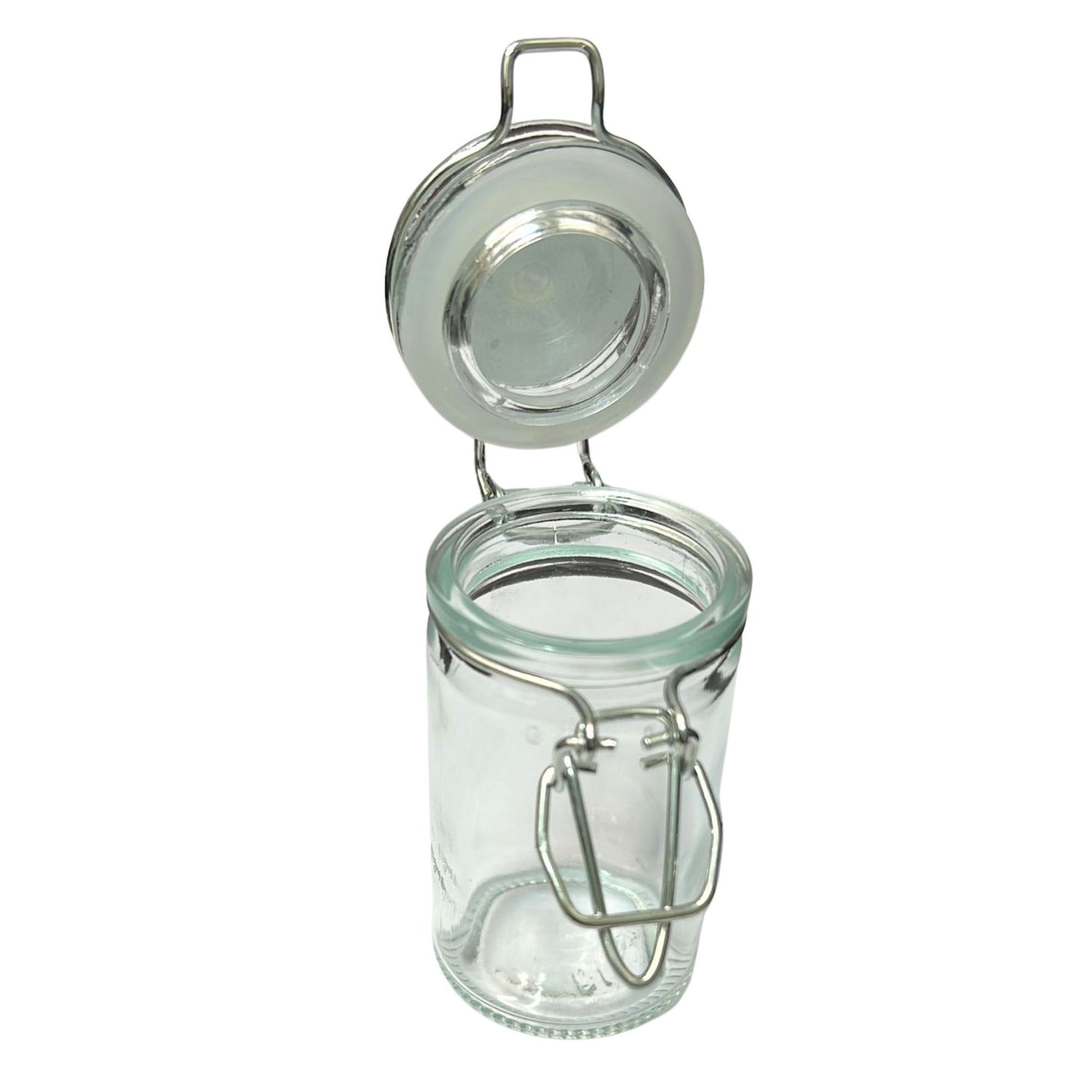 Clear glass jar with metal clasp lid on a white background