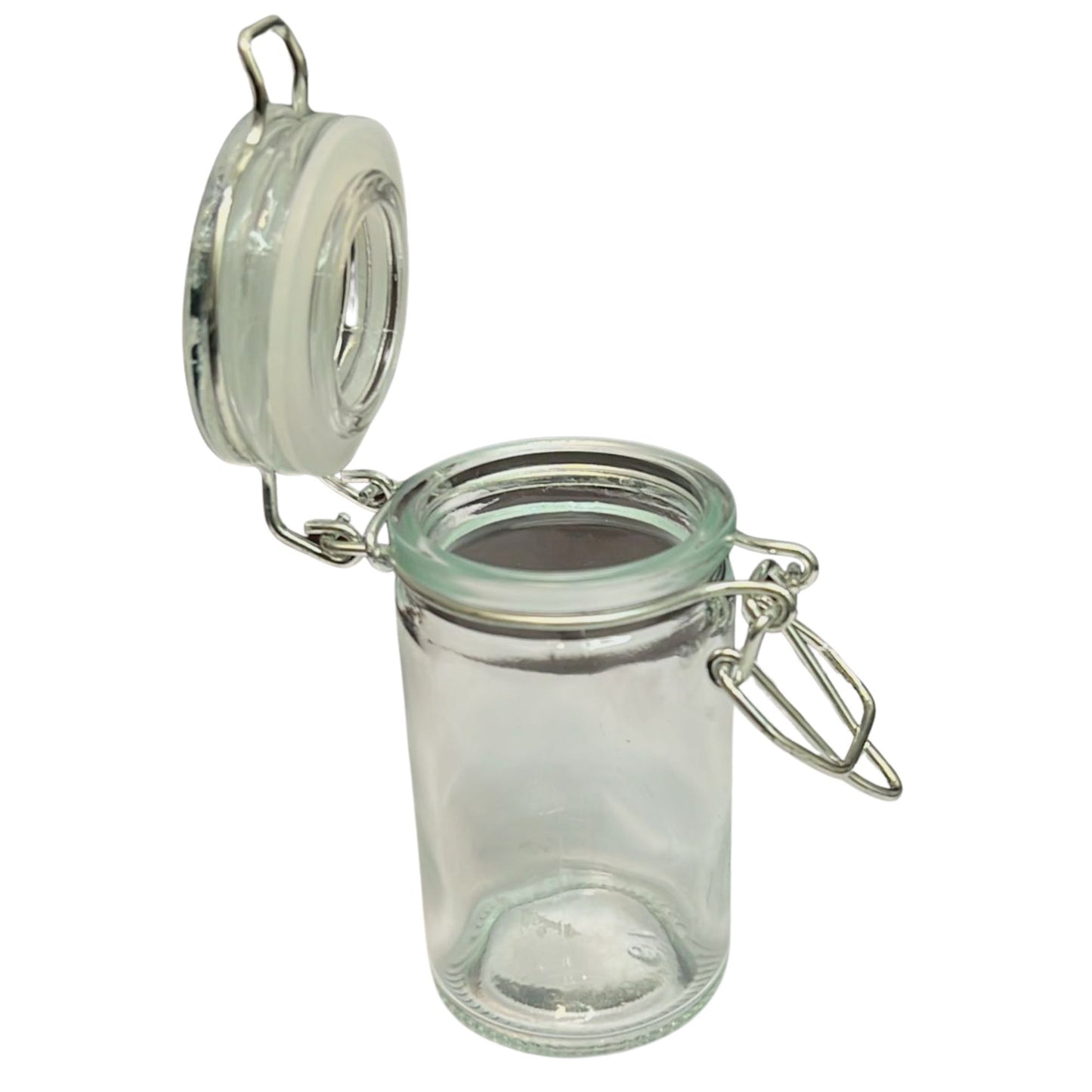 Clear glass jar with a metal clasp on a white background