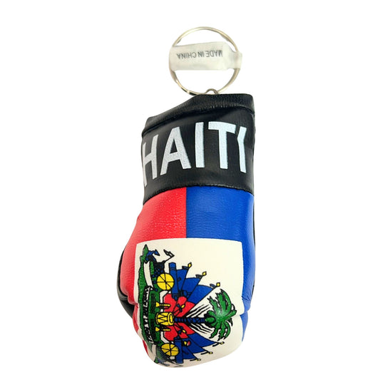 Keychain in the shape of a boxing glove with Haiti text and flag design on a white background