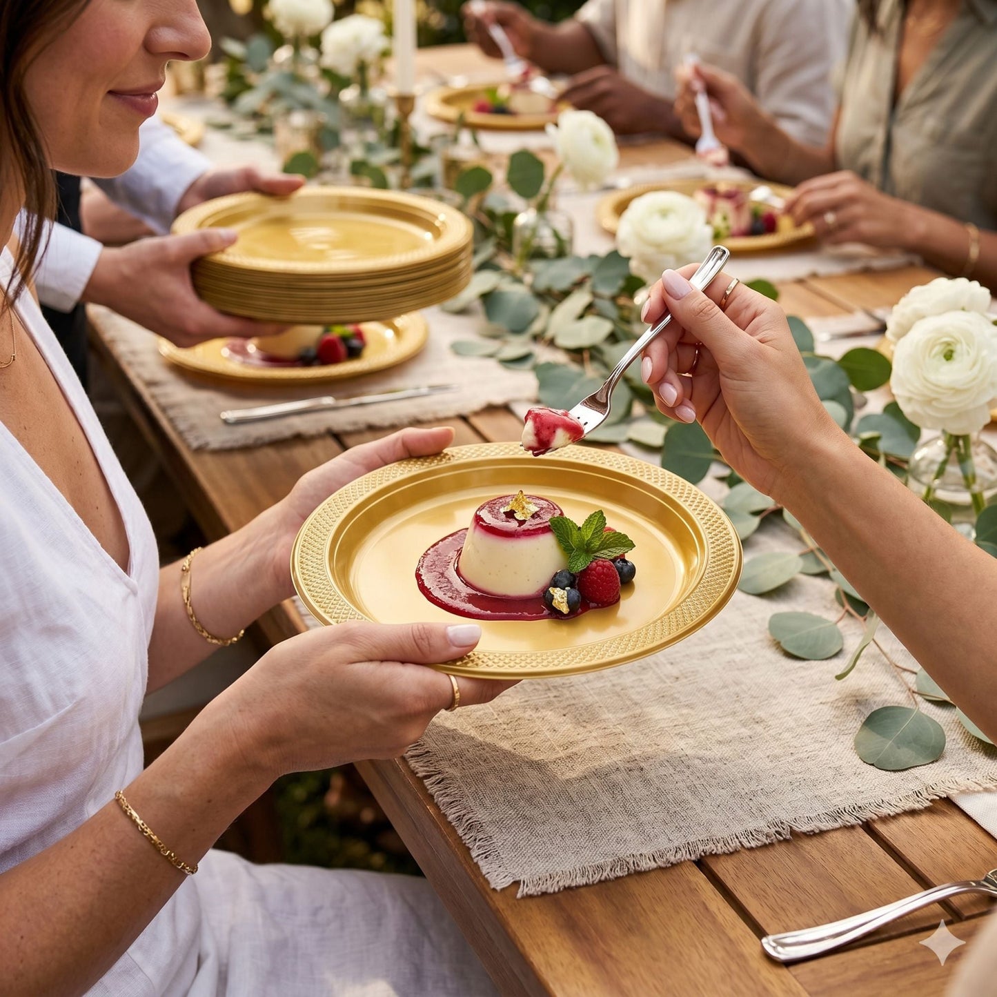 gold disposable plastic plates used for dessert at elegant outdoor dining table