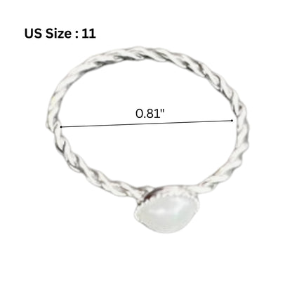 Silver ring with a measurement label on a white background