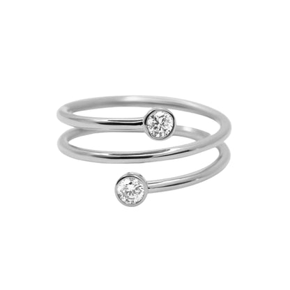 Two silver rings with small diamonds on a white background