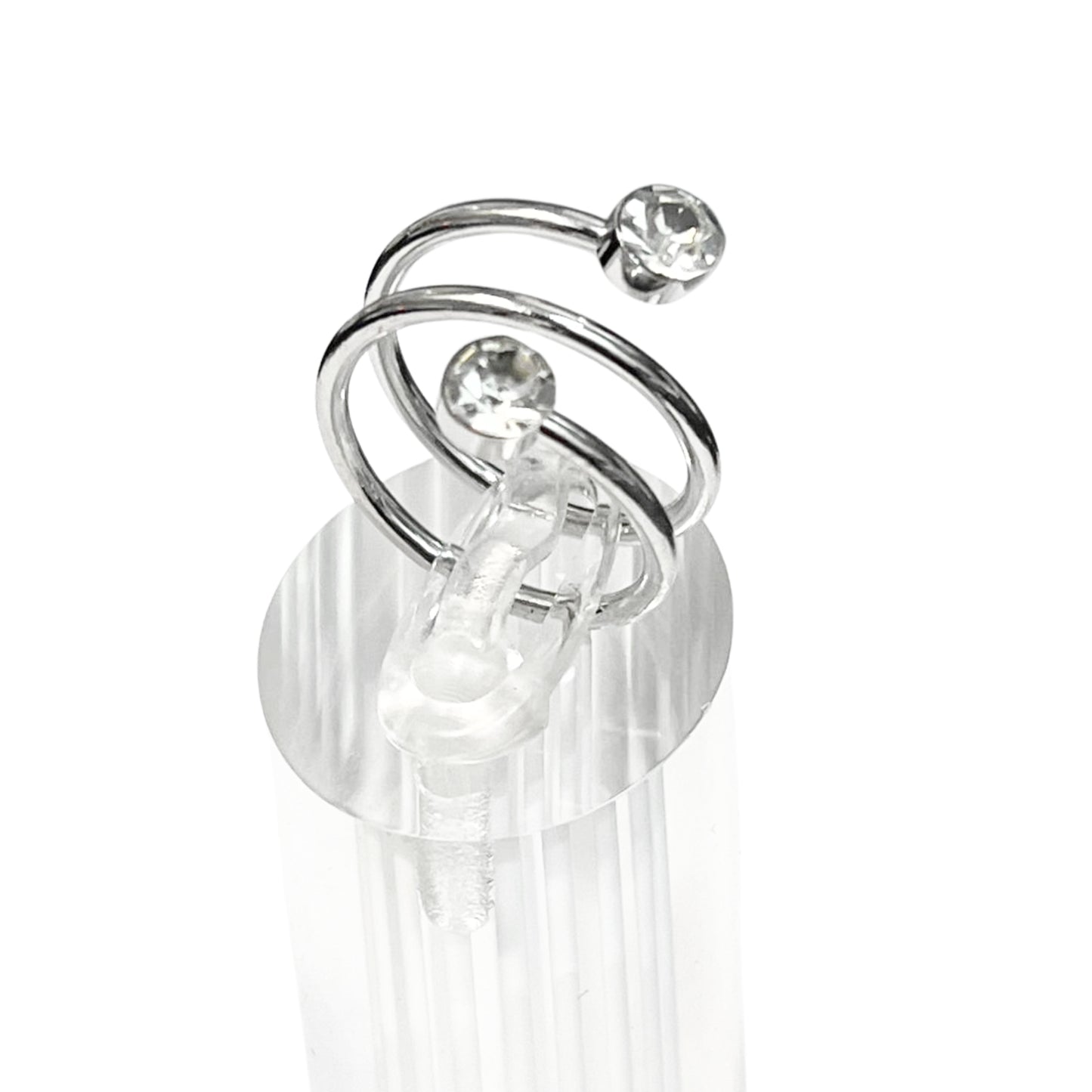 Silver earring with clear gemstones on a white background