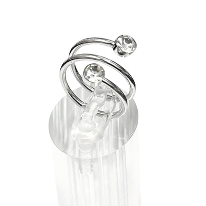 Silver earring with clear gemstones on a white background