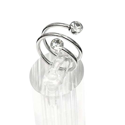 Silver earring with clear gemstones on a white background