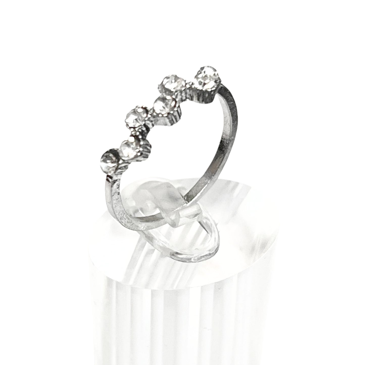Silver ring with gemstones on a white background