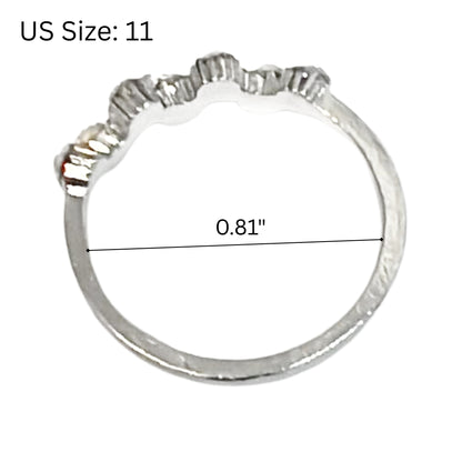 Silver ring with measurement details on a white background