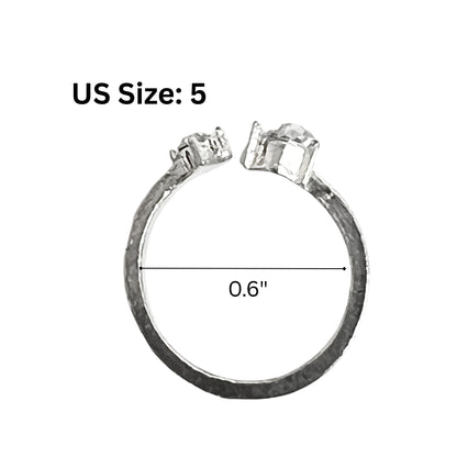 Silver ring with measurements on a white background