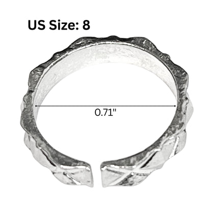 Silver ring with geometric design and size measurement on a white background