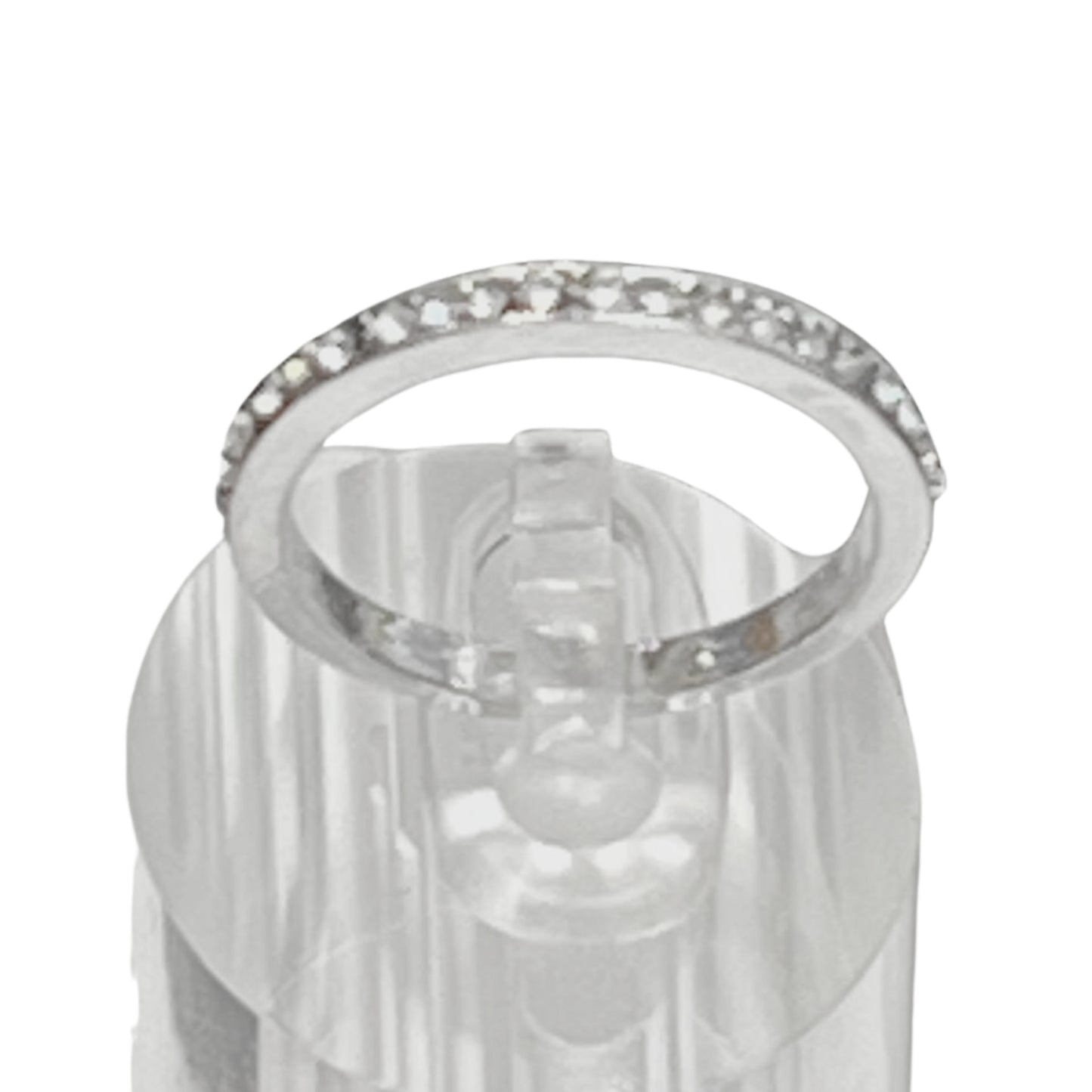 Silver ring with clear gemstones on a white background