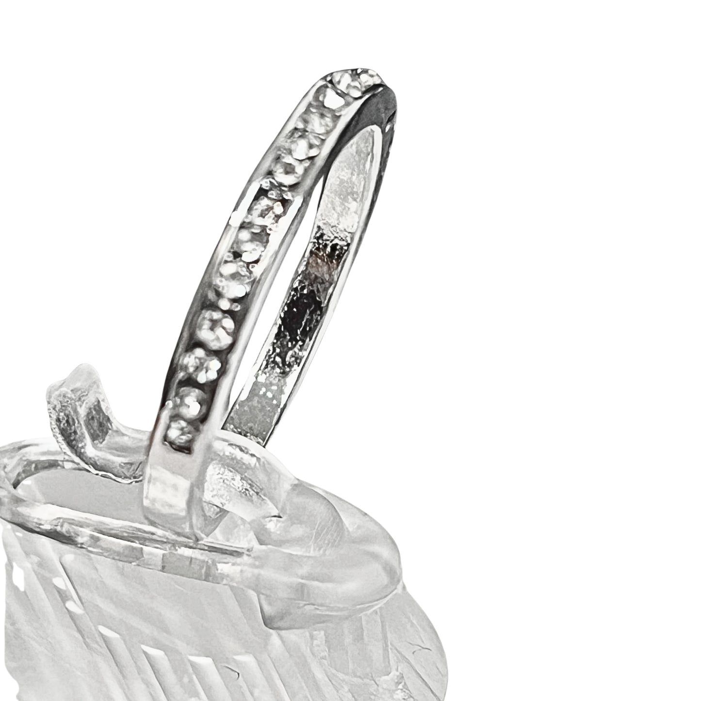 Silver ring with small stones on a white background