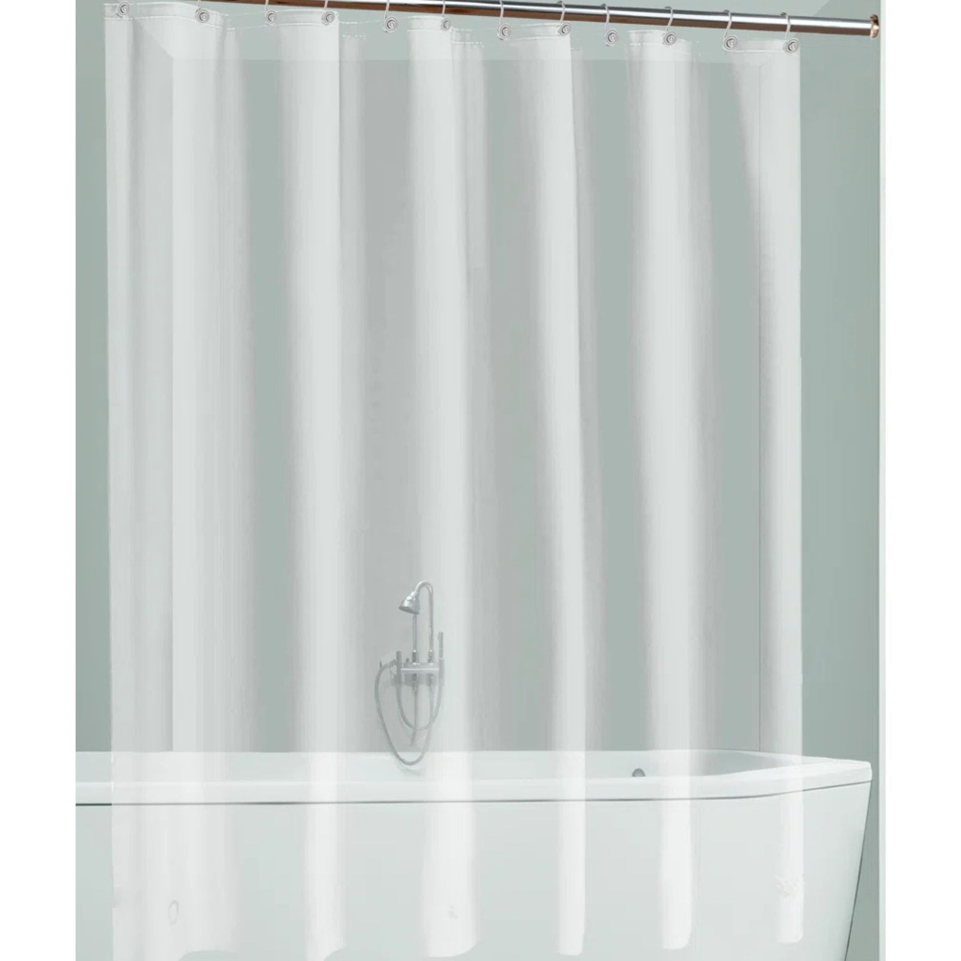 Clear shower curtain over a white bathtub with a silver faucet.