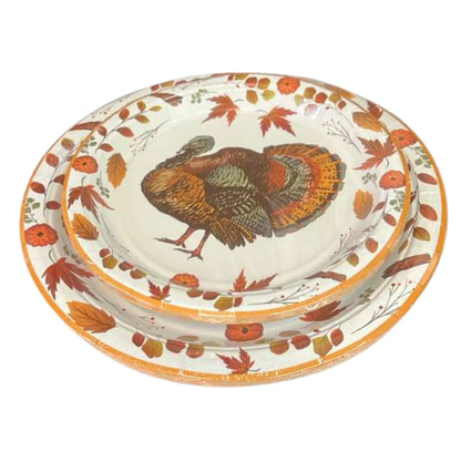 Decorative plate with a turkey design and autumn leaves on a white background