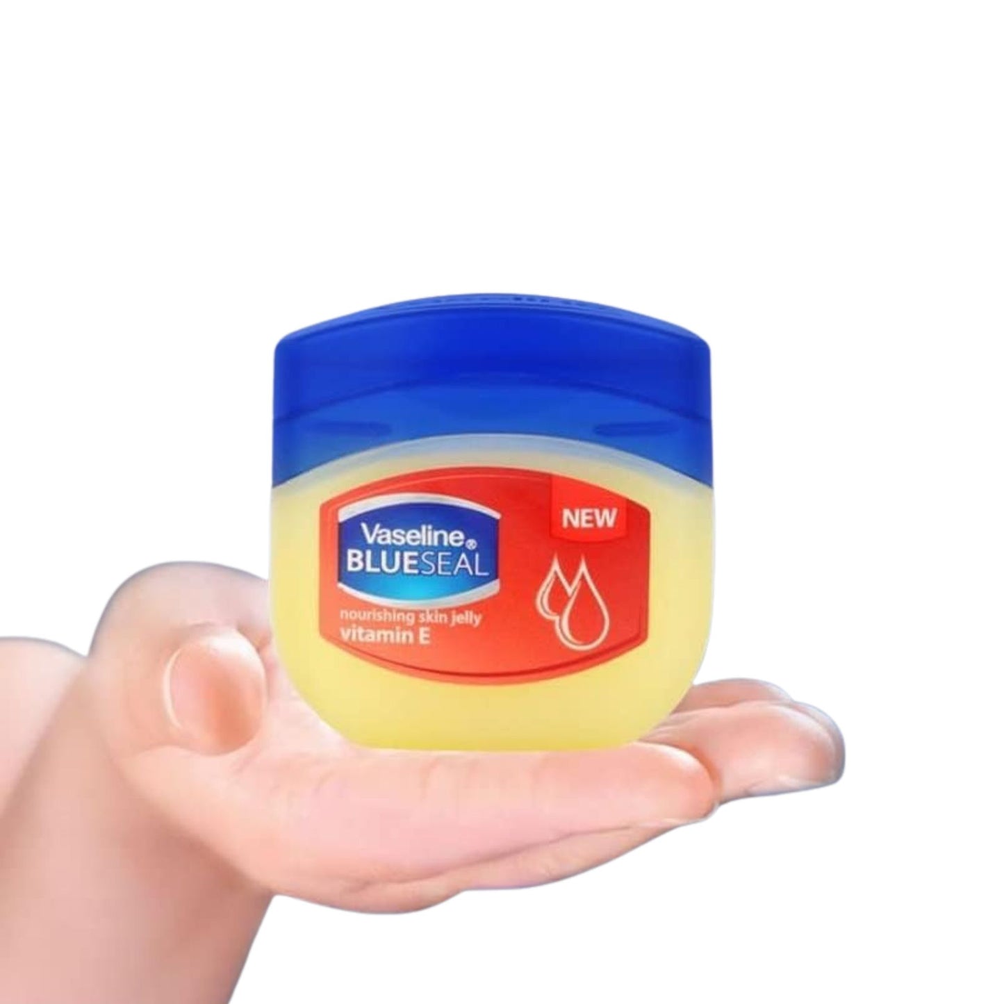 Hand holding a jar of Vaseline Blue Seal jelly with a blue lid.