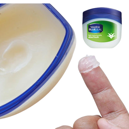 Vaseline Blue Seal aloe fresh jar with a hand applying jelly to a finger