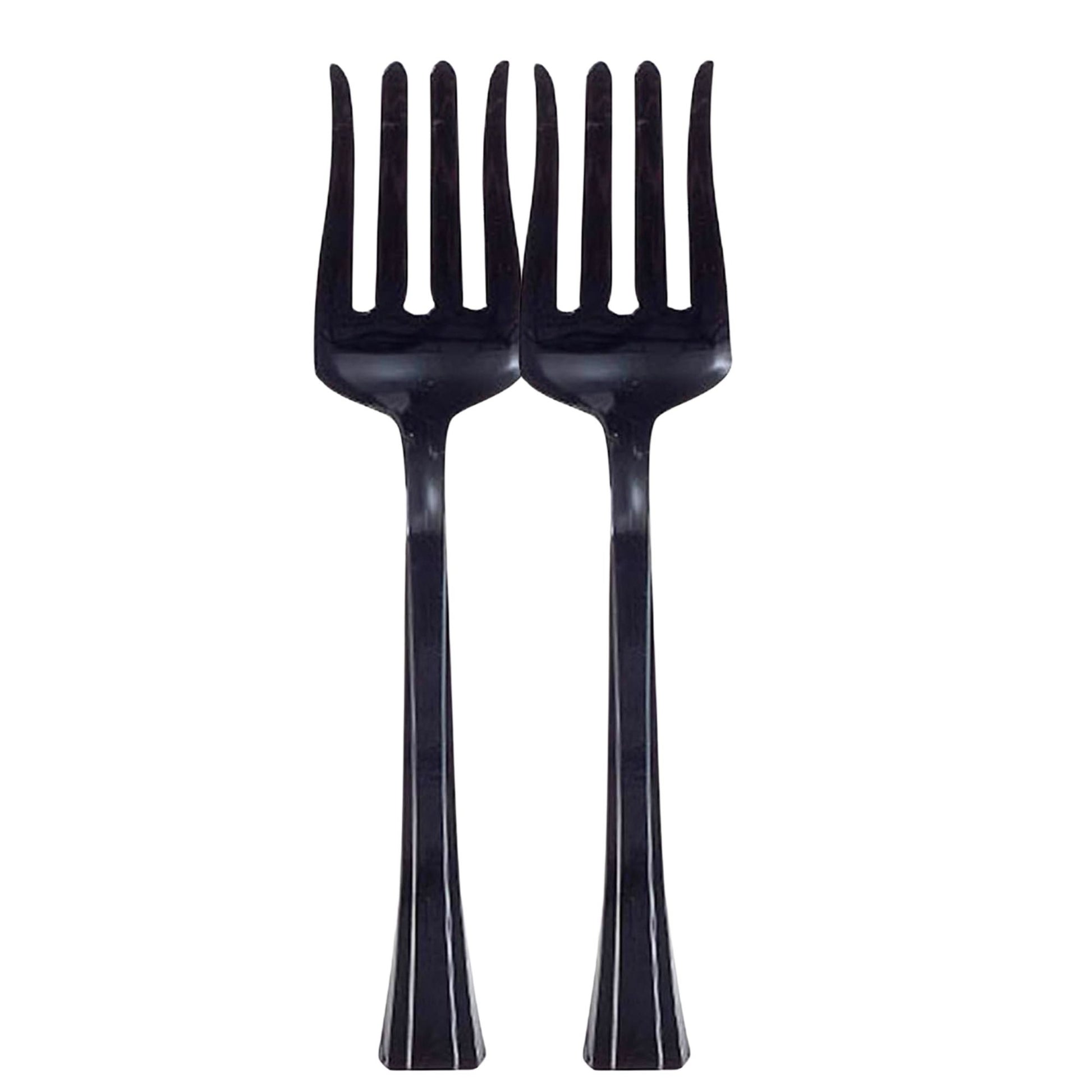 Two black plastic forks on a white background